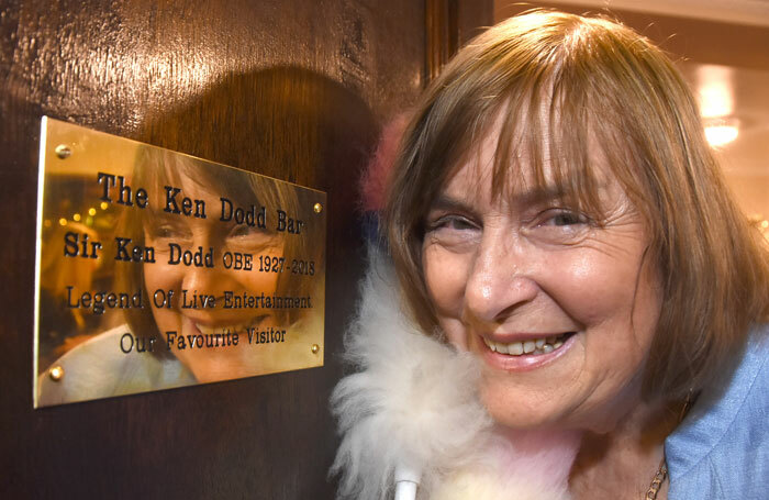 Anne Dodd with the memorial plaque at the Grand Opera House in York. Photo: David Harrison/Grand Opera House York