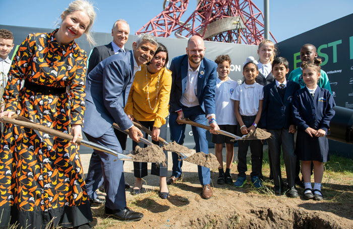 London mayor Sadiq Khan helps to bury a time capsule  at the East Bank site