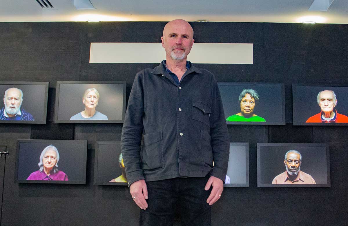 Tim Crouch in front of the screens for House Mother Normal. Photo: Jamie MacMillan