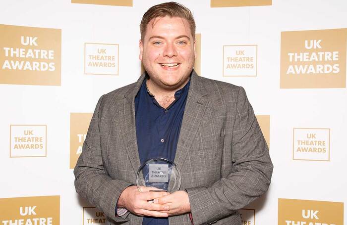 ATG creative producer Conor Hunt with the workforce award at the UK Theatre Awards. Photo: Ewa Ferdynus