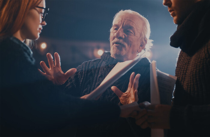 A director guides a scene between two actors. Photo: Shutterstock A director guides a scene between two actors. Photo: Shutterstock