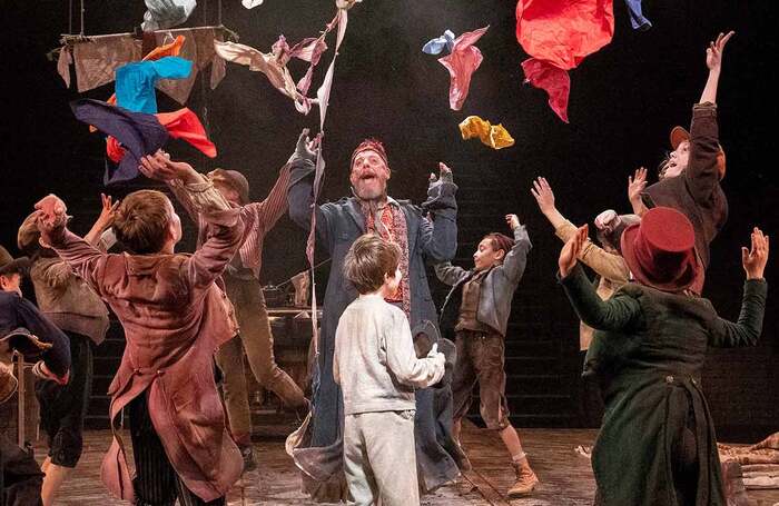 Steve Furst (centre) in Oliver! at Leeds Playhouse. Photo: Alastair Muir