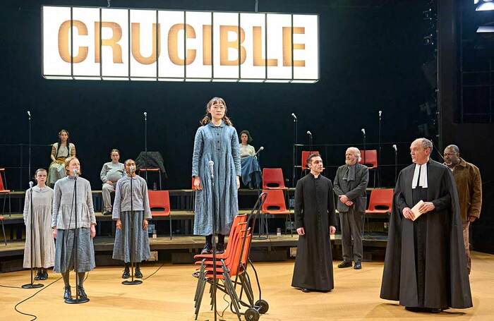 Millicent Wong (on chair) and the Company in The Crucible at the Crucible, Sheffield. Photo: Manuel Harlan. Millicent Wong (on chair) and the Company in The Crucible at the Crucible, Sheffield. Photo: Manuel Harlan.