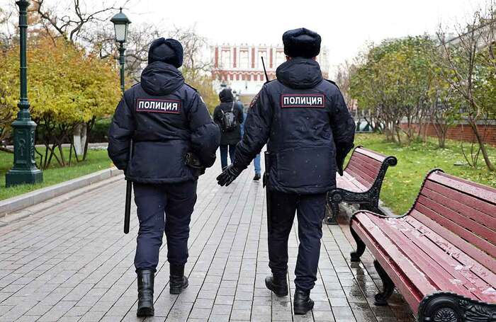 Russian police officers patrol a city street in Moscow. Photo: Shutterstock