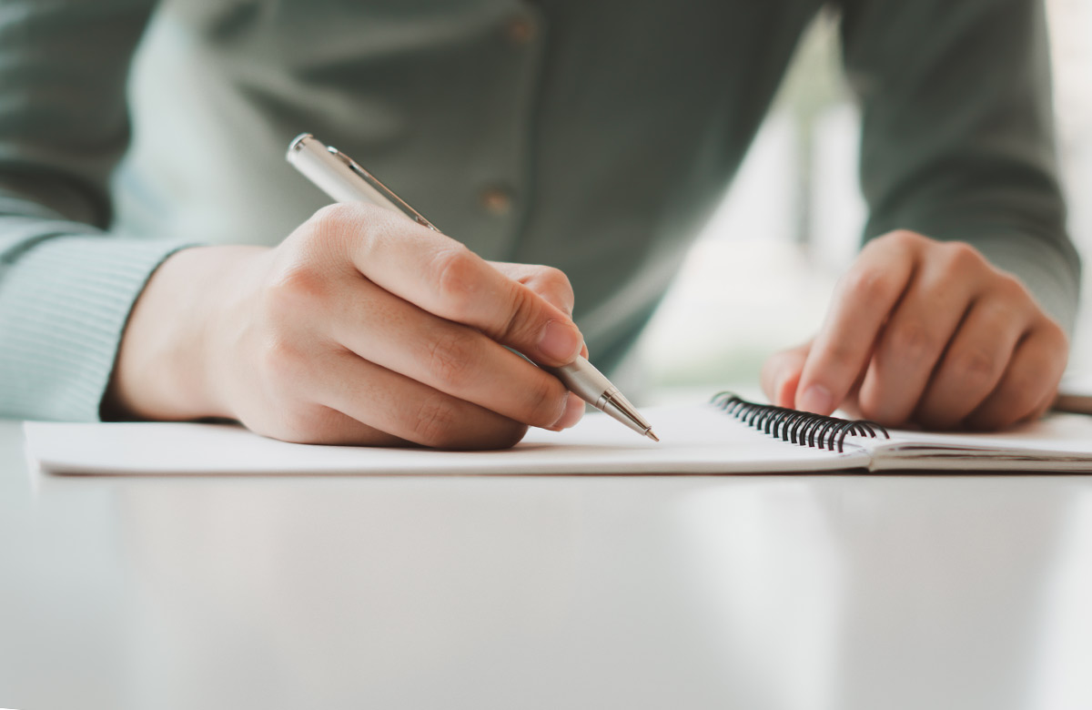 pen and paper writer writing playwright shutterstock