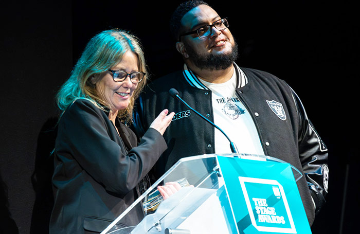 Synergy Theatre Project's Esther Baker and Karl Smith collecting the Community Award at The Stage Awards ceremony. Photo: Charlie Lyne