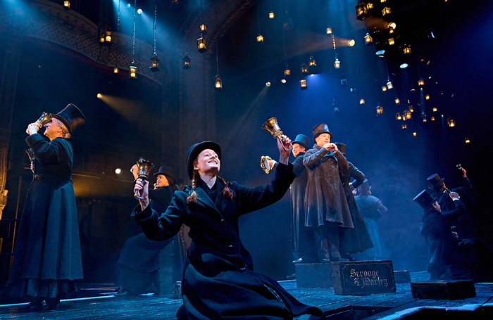 Cast members on stage in A Christmas Carol at the Old Vic in 2023. Photo: Manuel Harlan