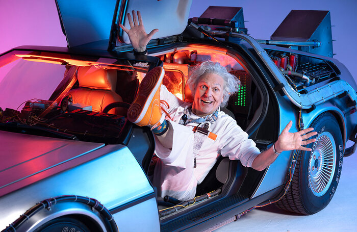 Brian Conley as Doctor Emmett Brown in Back to the Future the Musical. Photo by Hugo Glendinning