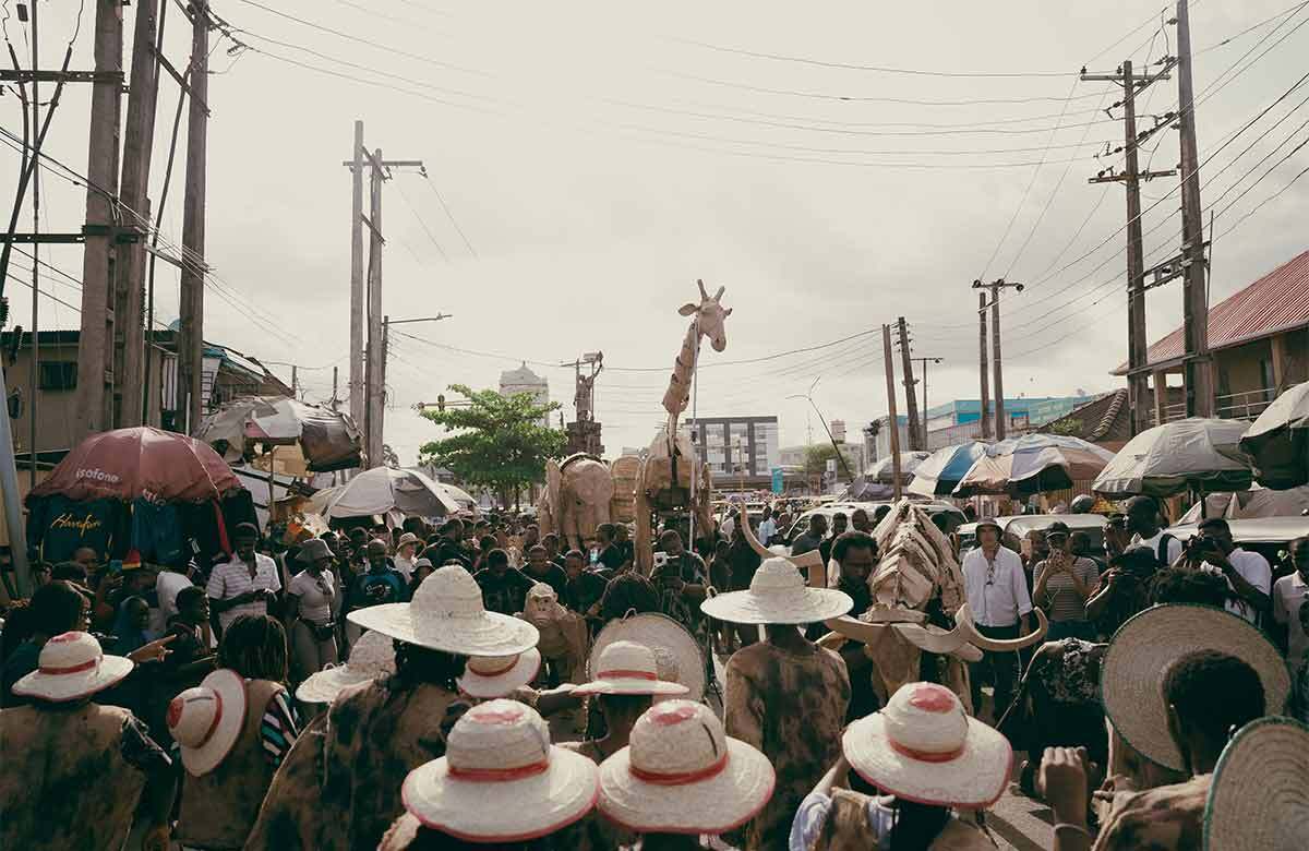 A puppet from The Herds project makes its way through the Sabo Yaba Market, in Lagos, Nigeria. Photo: Kashope Faje for 88 Life Studios A puppet from The Herds project makes its way through the Sabo Yaba Market, in Lagos, Nigeria. Photo: Kashope Faje for 88 Life Studios