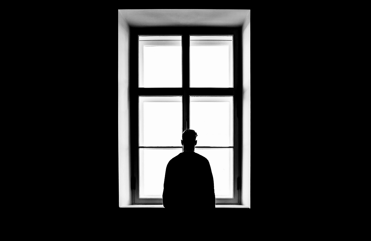 Silhouette of man at window. Photo: Shutterstock