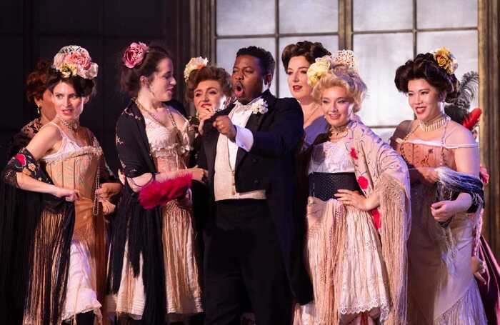 Zwakele Tshabalala and the Opera Holland Park Chorus in La Traviata at Holland Park Theatre, London. Photo: Ali Wright