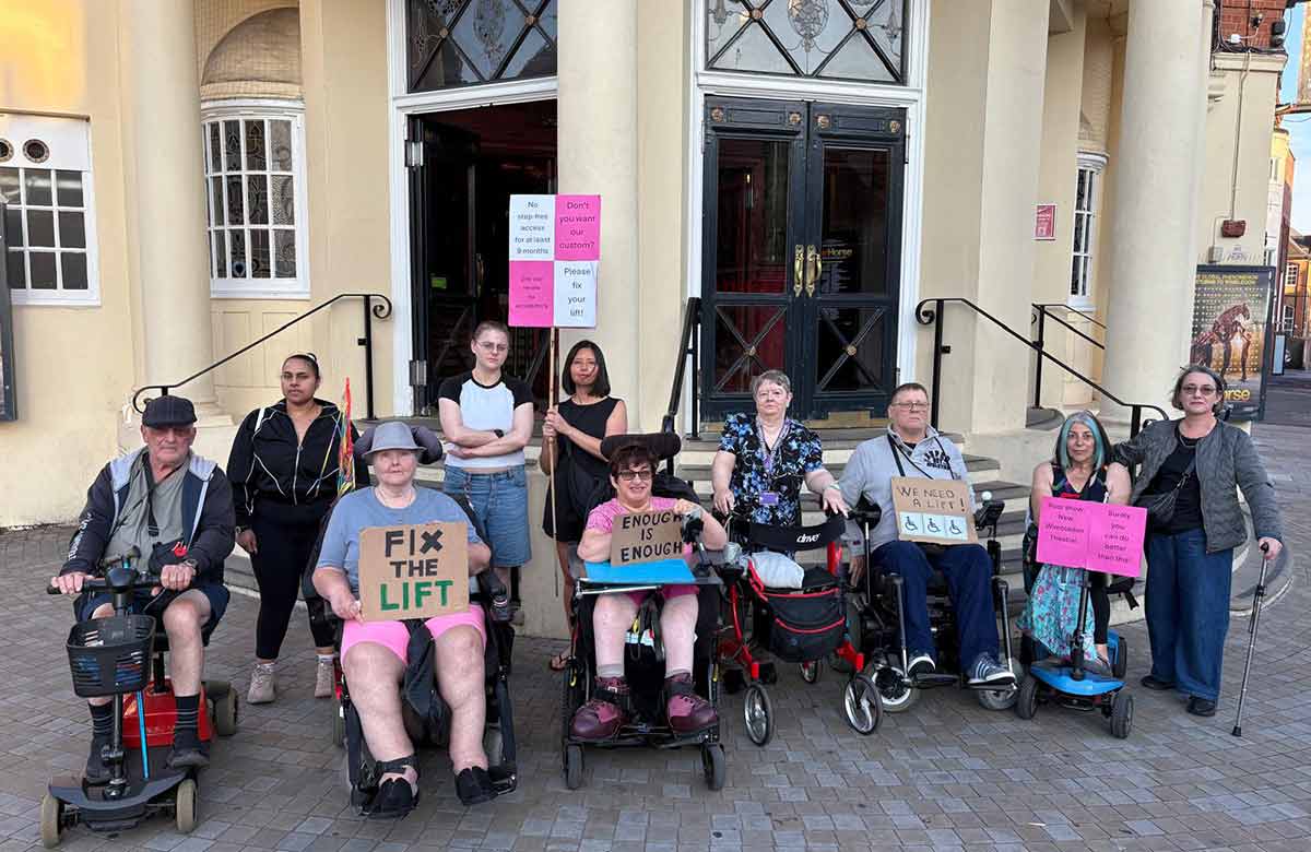 Merton Centre for Independent Living members protesting in front of New Wimbledon Theatre. Photo: Chris Stanton