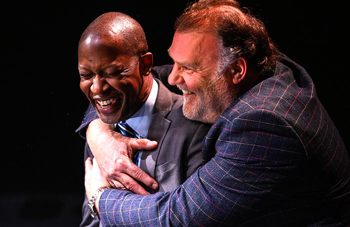 Award winner, stage door manager Eugene Ju-Pierre is congratulated by Bryn Terfel at The Stage Awards ceremony this year. Photo: David Monteith-Hodge