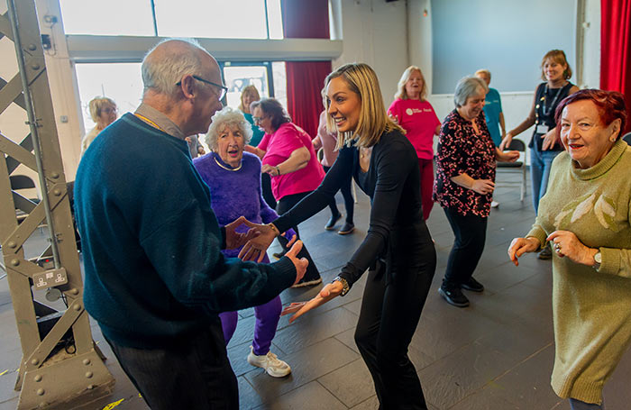 Amy Dowden with participants of a dance class