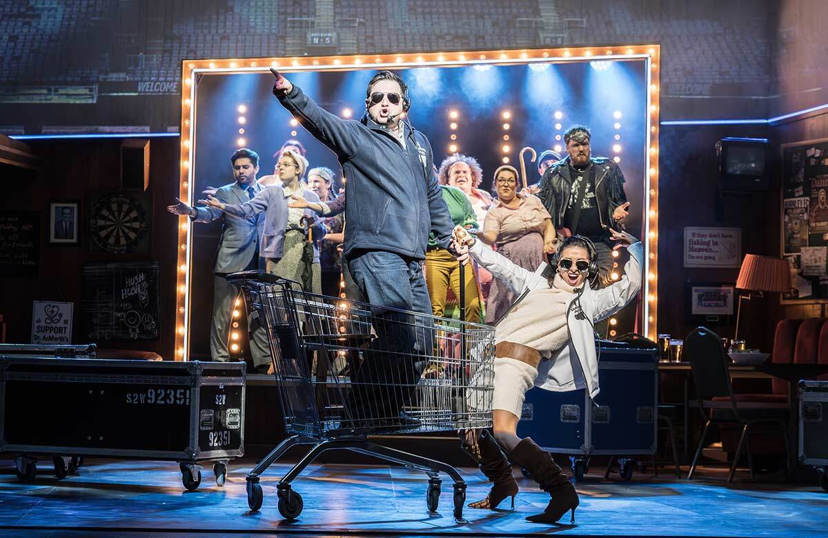 Sam Lupton, Hayley Tamaddon and cast of Bank of Dave: The Musical at the Lowry, Salford. Photo: Marc Brenner