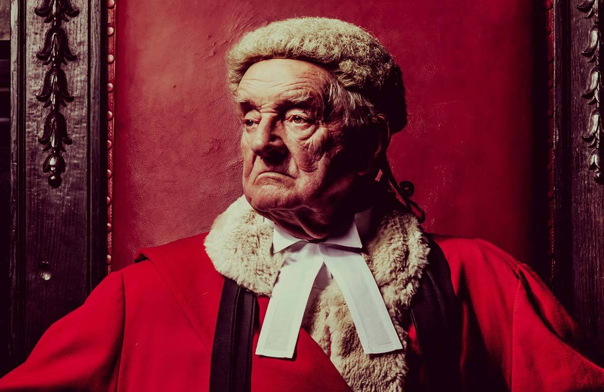 Patrick Godfrey in Witness for the Prosecution at County Hall, London (2017). Photo: Idil Sukan Patrick Godfrey in Witness for the Prosecution at County Hall, London (2017). Photo: Idil Sukan